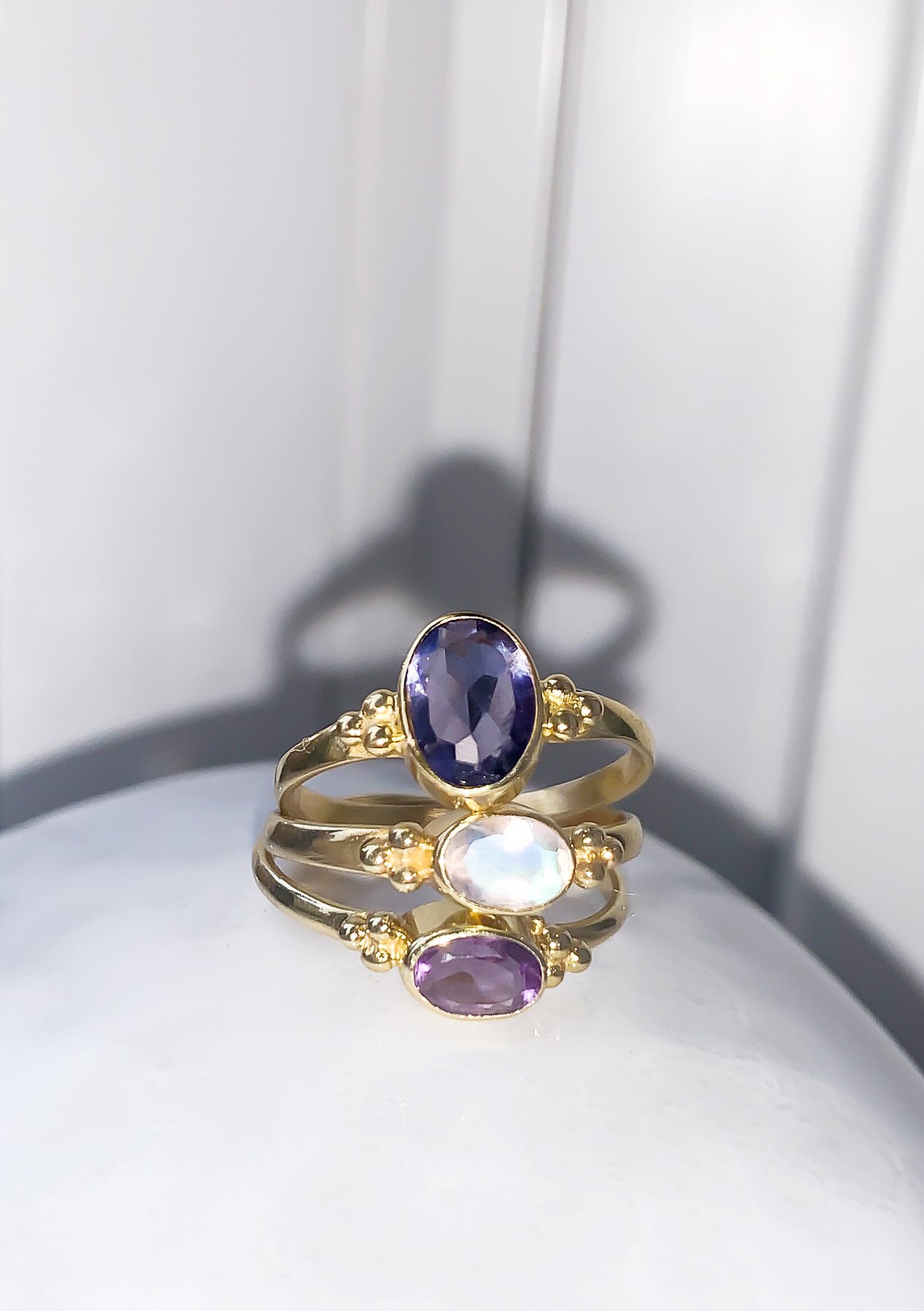 Tiny Facet Amethyst Oval Triquetra Gold