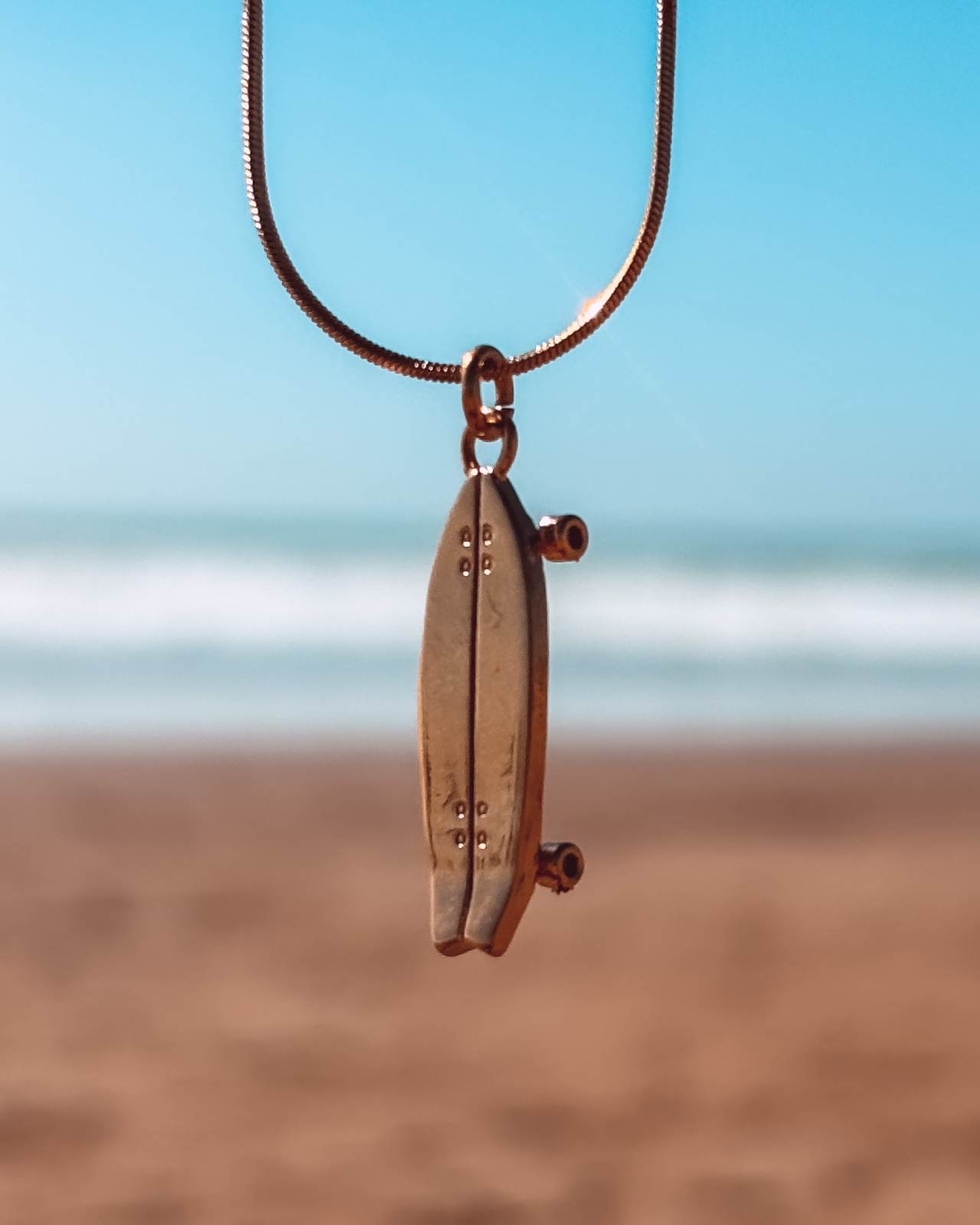 Oceaan Surfskateboard ketting goud