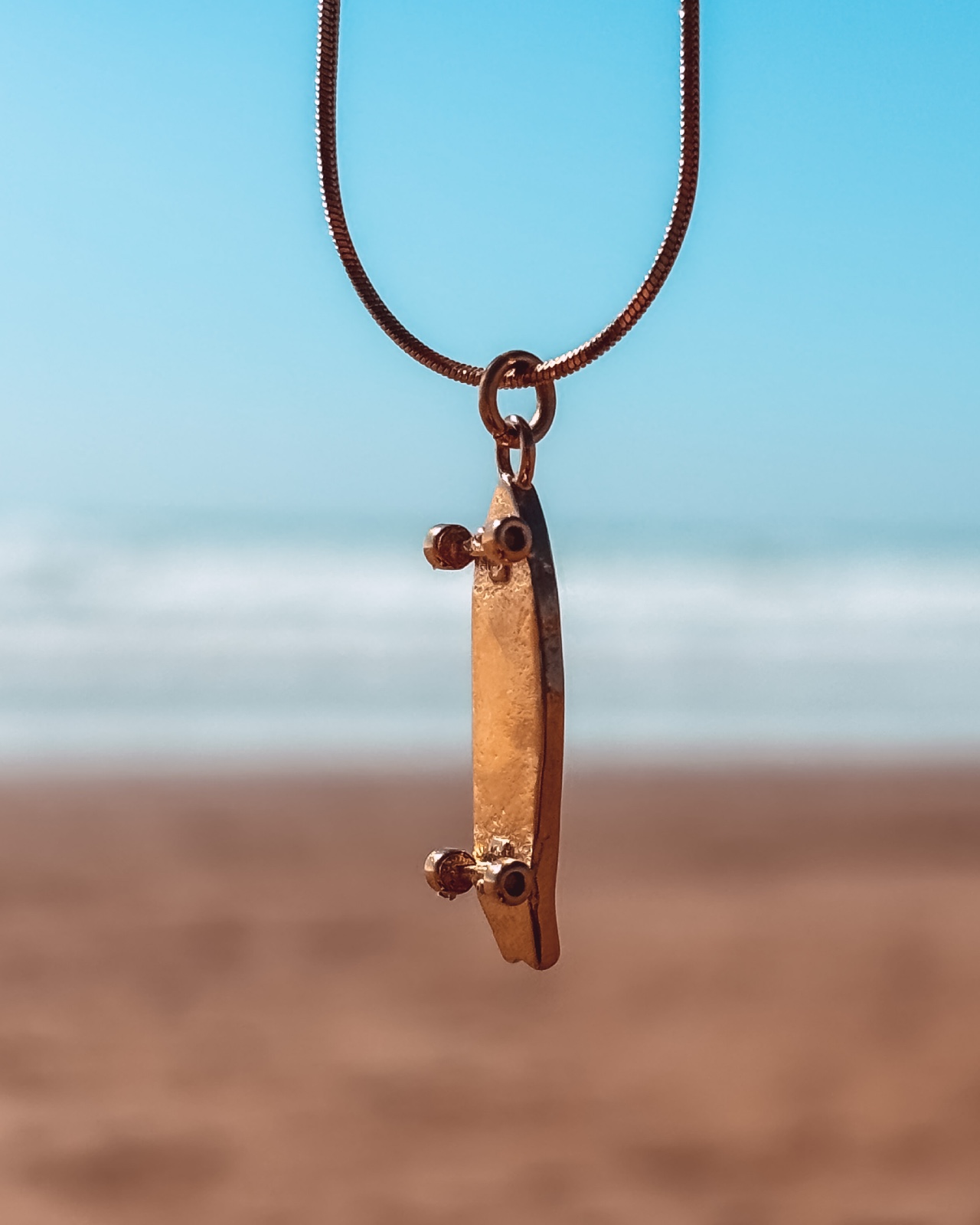 Oceaan Surfskateboard ketting goud