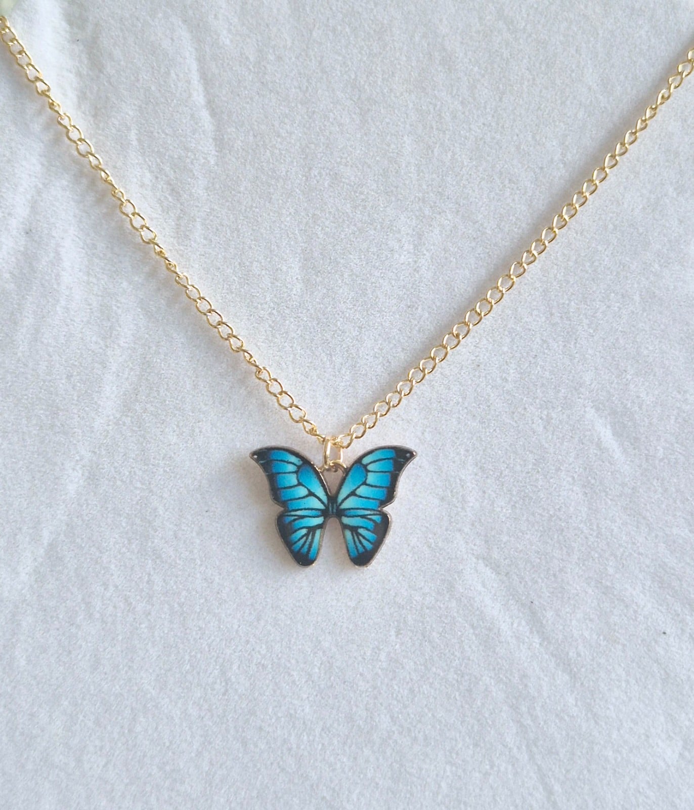 Vlinder ketting blauw