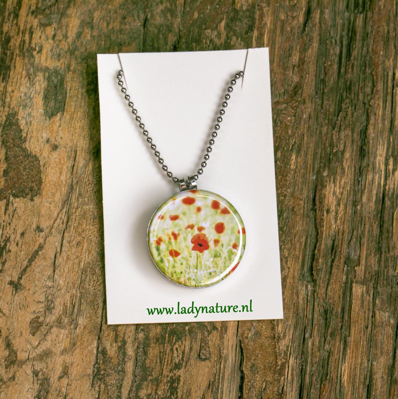 Foto medaillon ketting met 4 verschillende verwisselbare voorkanten m… - 90310 Foto medaillon ketting met 4 verschillende verwisselbare voorkanten met close up foto`s van zacht roze,gele en zalm kleurige bloemen.