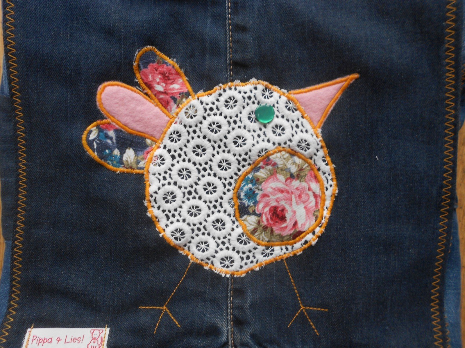 Tas van spijkerstof met grappig vogeltje