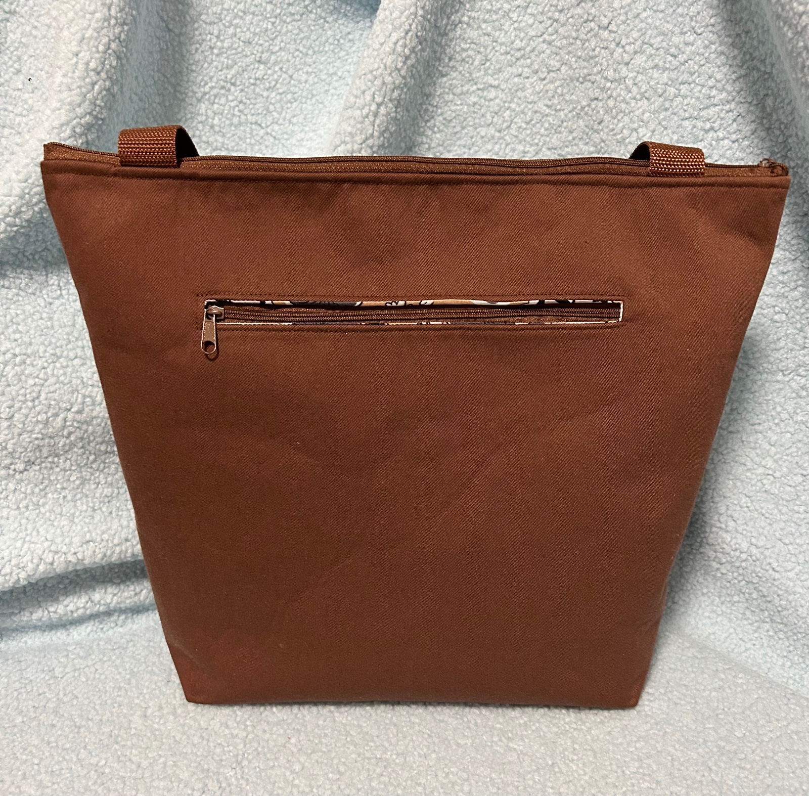 Bruine tas met geborduurd Afrikaans hoofd