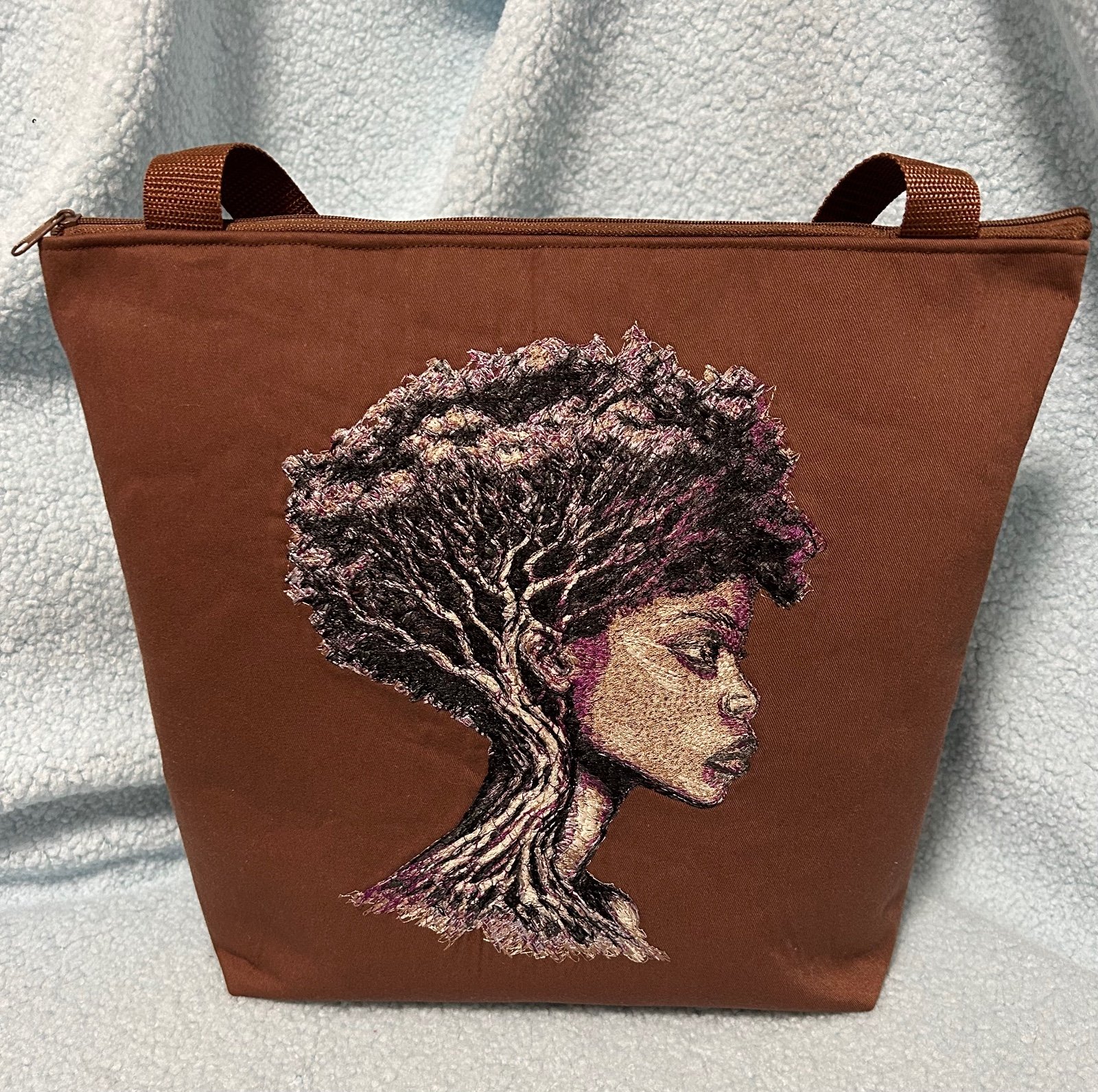 Bruine tas met geborduurd Afrikaans hoofd