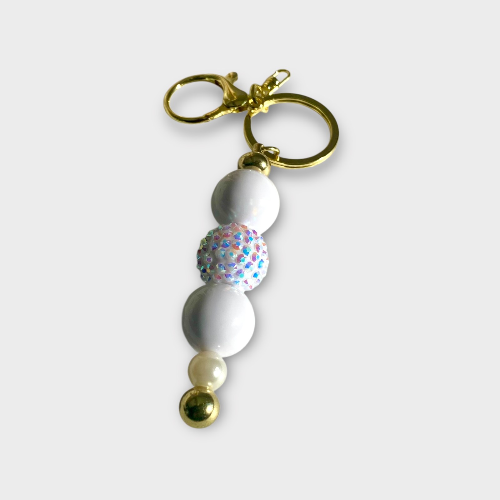 Handgemaakte Kralen Sleutelhangers – Stijlvol in Goud, Wit, Fuchsia & Roze