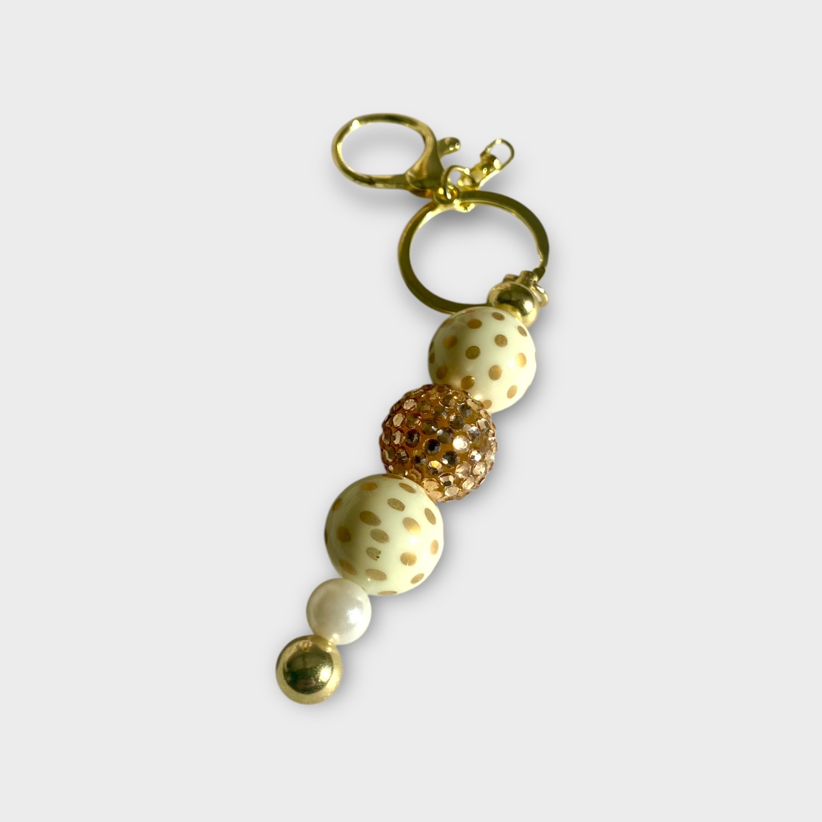 Handgemaakte Kralen Sleutelhangers – Stijlvol in Goud, Wit, Fuchsia & Roze