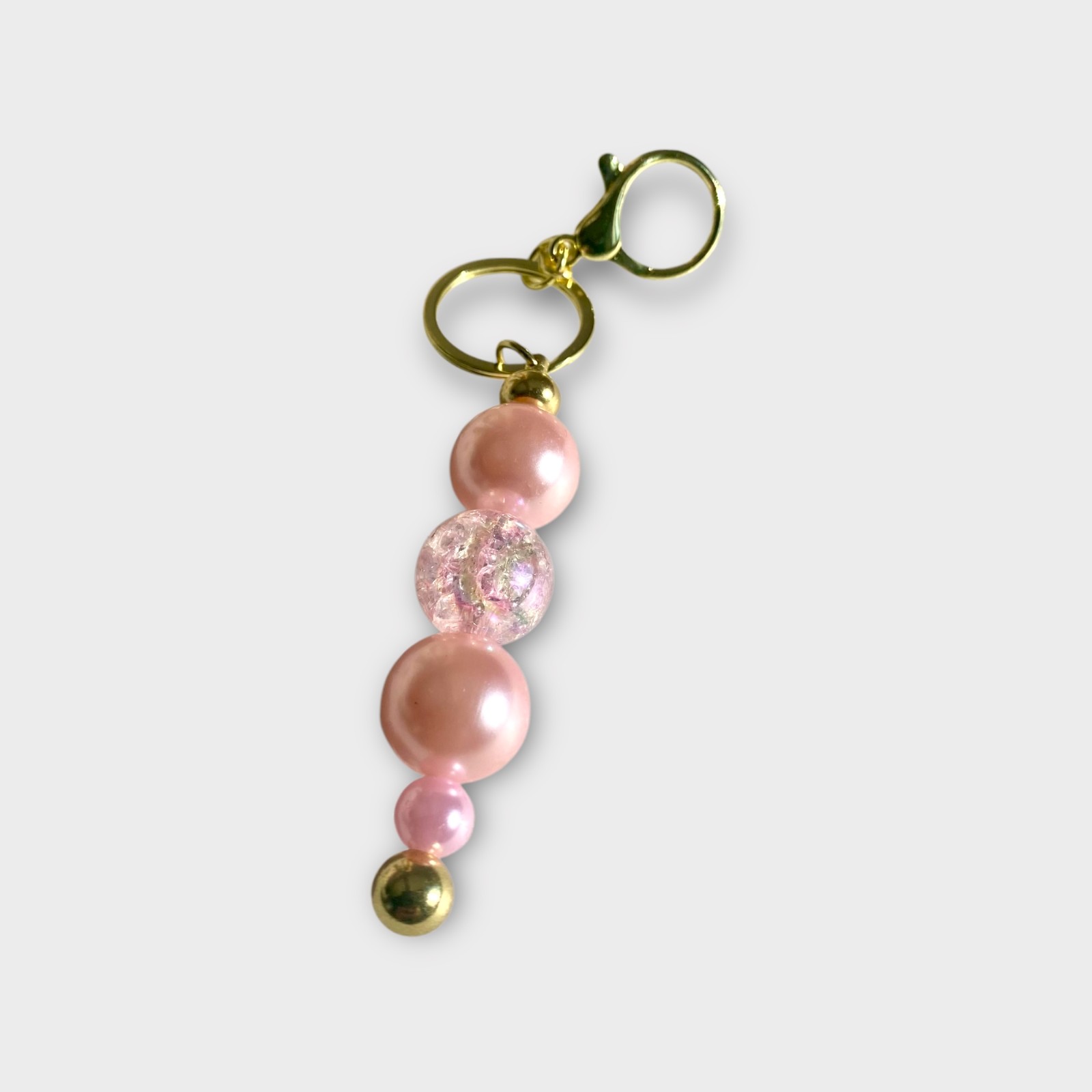 Handgemaakte Kralen Sleutelhangers – Stijlvol in Goud, Wit, Fuchsia & Roze