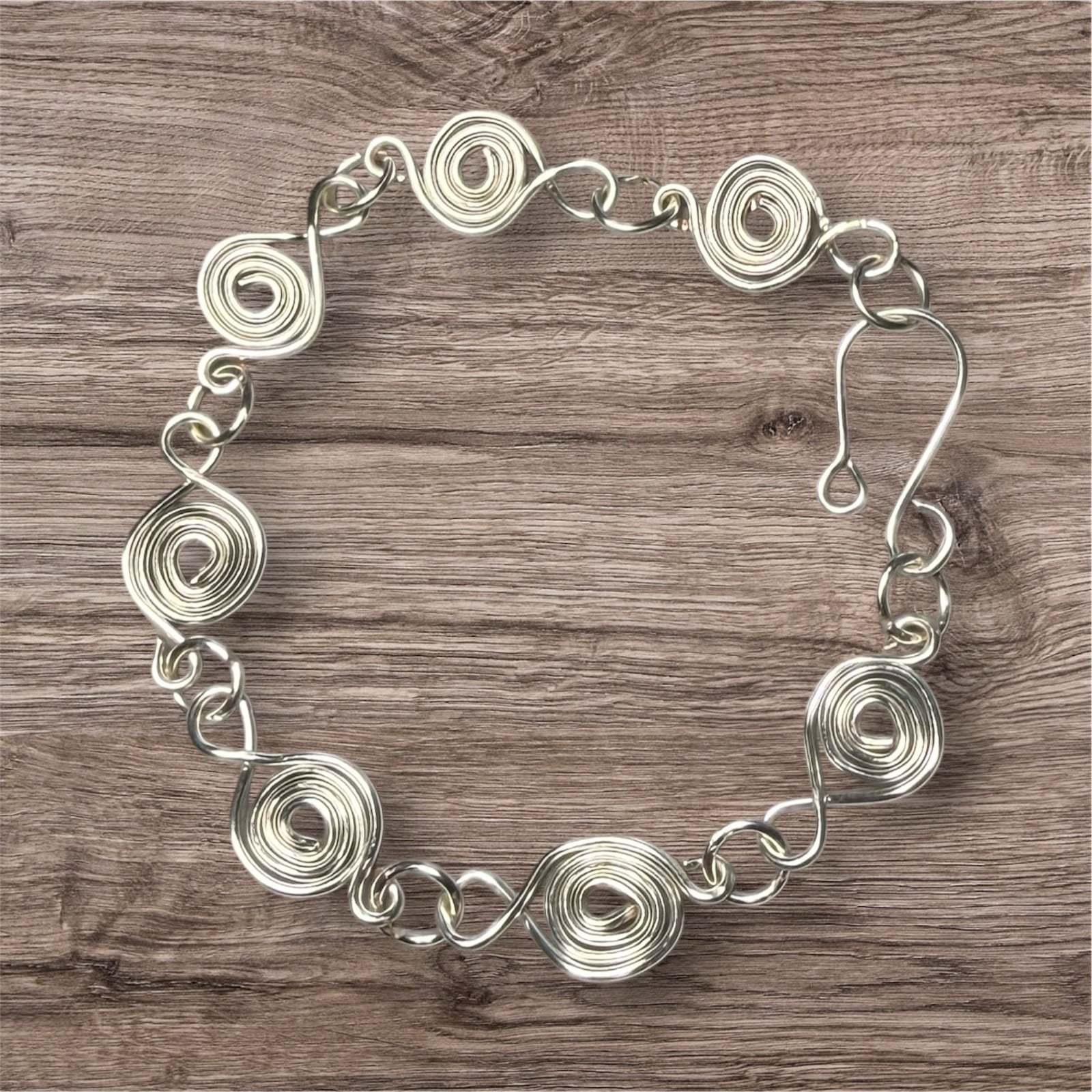 Zilveren armband met zwanenmotief en spiraalvormige schakels - 155155 Zilveren armband met zwanenmotief en spiraalvormige schakels