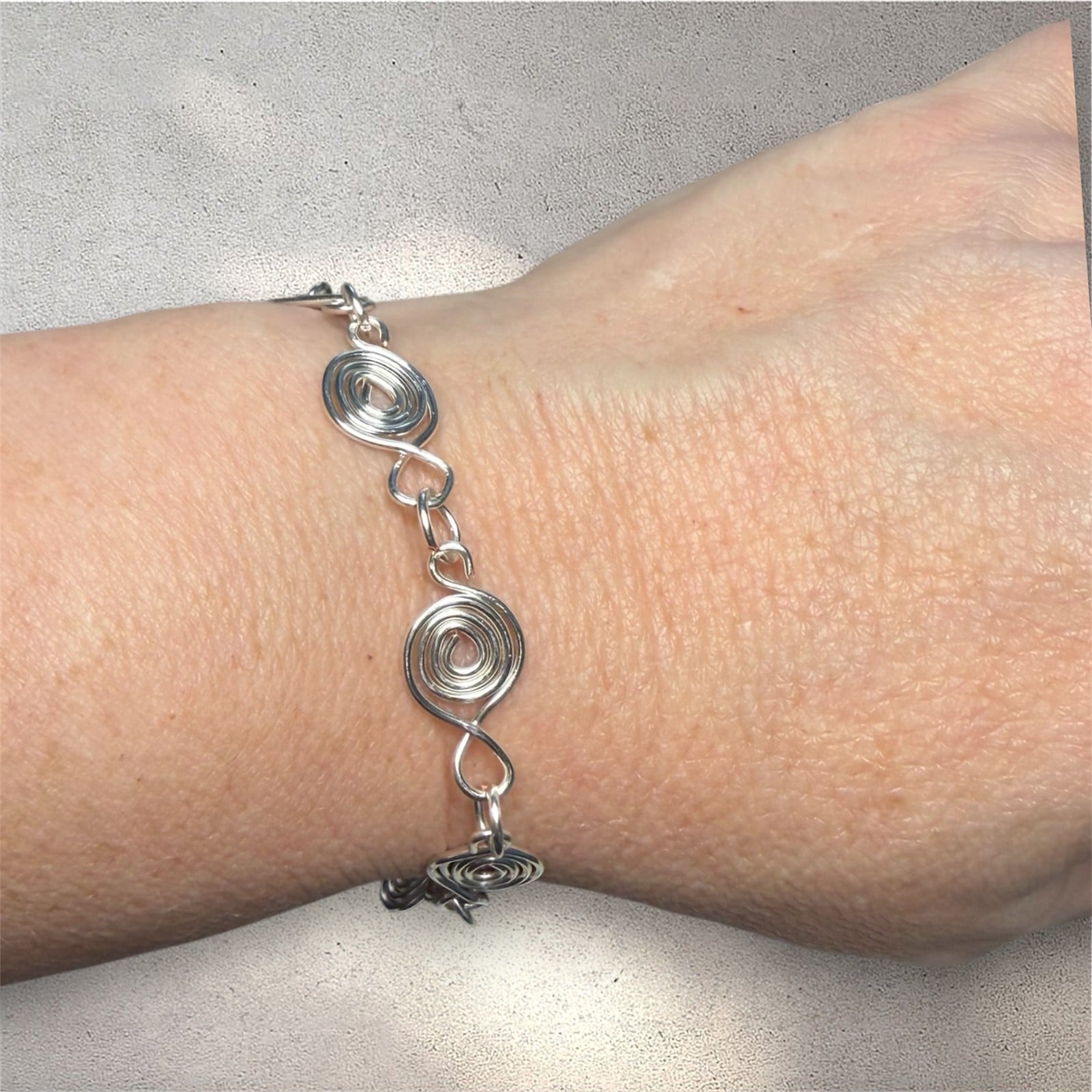 Zilveren armband met zwanenmotief en spiraalvormige schakels - 155156 Zilveren armband met zwanenmotief en spiraalvormige schakels