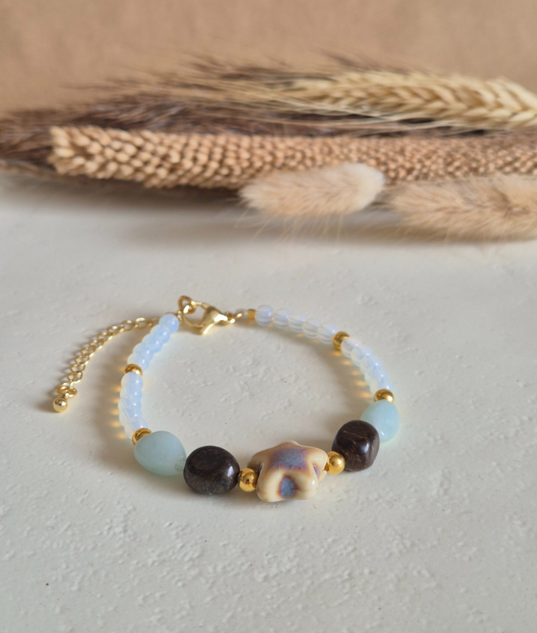 Gouden armband keramieken zeester - 137799 Gouden armband keramieken zeester