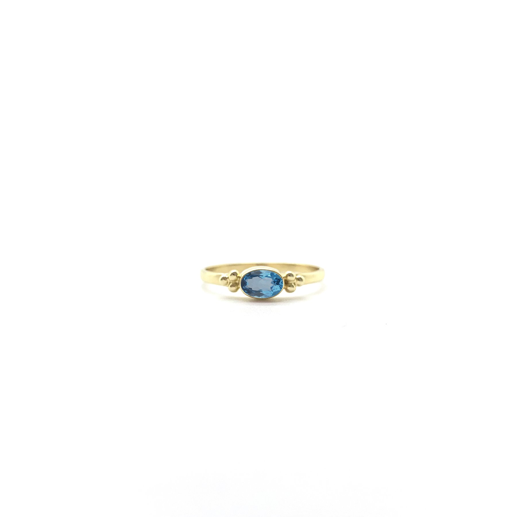 Tiny Facet Swiss Blue Topaz Oval Triquetra Gold