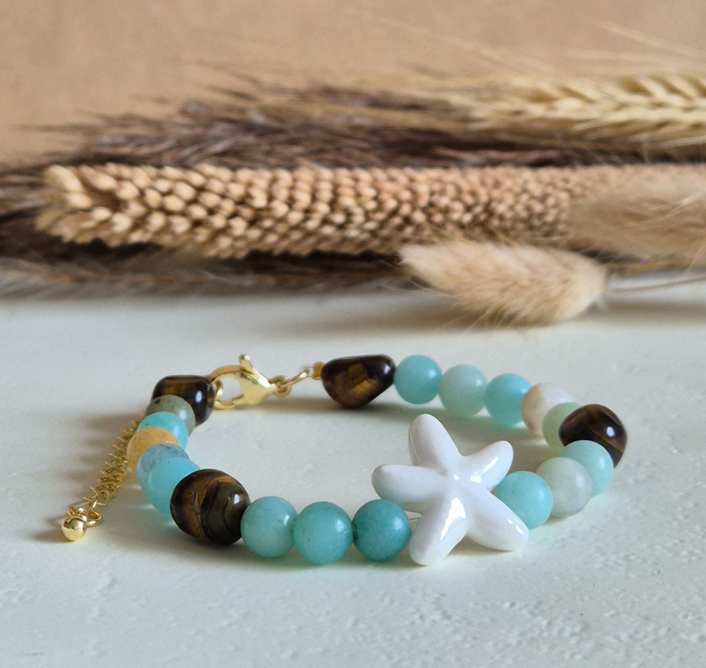 Zomerse zeester armband goud - 134347 Zomerse zeester armband goud