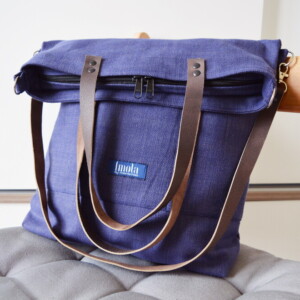 Variabele schoudertas met leren bandjes