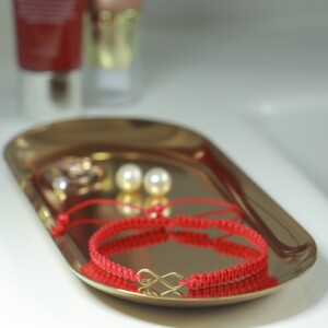 Armband met 14 karaat geelgouden Infinity - met twee hartjes