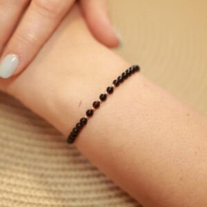 Elegante zwart onyx armband met 14 karaat geegouden kralen 2,5 mm