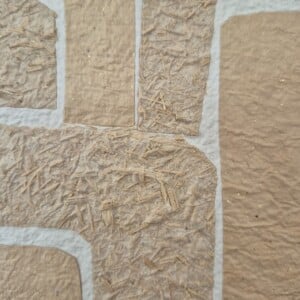Handgeschept papier abstracte vormen in een houtkleurige A4 lijst