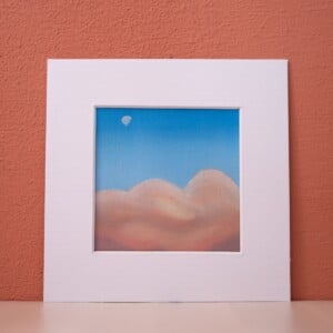 Klein schilderij in de wolken