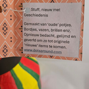 Originele, kleurrijke bloempot met gouden bril
