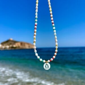 Handgemaakte kinder ketting met sterrenbeeld van schelp