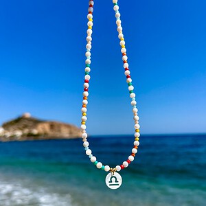 Handgemaakte kinder ketting met sterrenbeeld van schelp