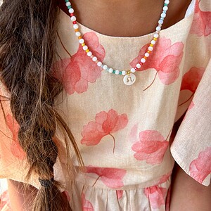 Handgemaakte kinder ketting met sterrenbeeld van schelp