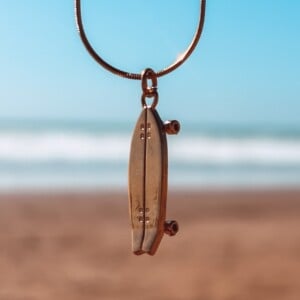 Oceaan Surfskateboard ketting goud