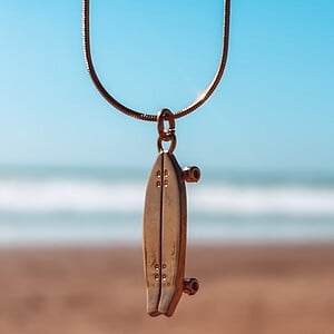 Oceaan Surfskateboard ketting goud