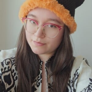 Gehaakte muts met imitatiebont | Zwart en oranje