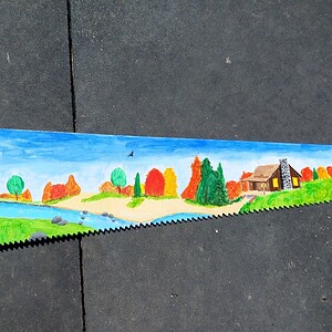 Handbeschilderde upcycled vintage metalen zaag met zwarte beer herfst landschap