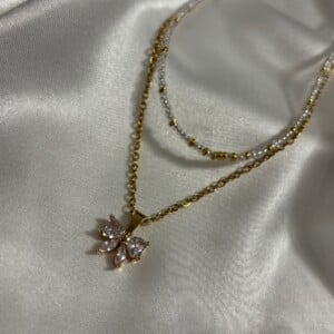 Luxe Goudkleurige Layering Ketting Set met Glinsterende Strik Hanger