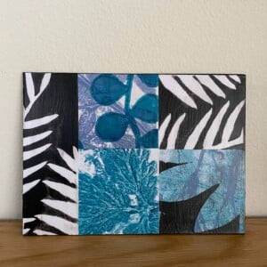 Grafische natuurcollage op hout