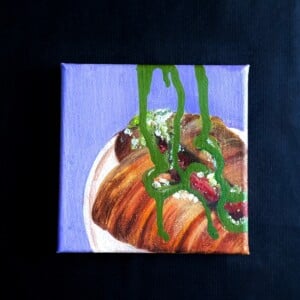 Food art schilderij croissant ‘Pistachio Drizzle’ – 15x15 cm – origineel acryl op canvas