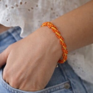Sinaasappel & Zonlicht, handgeweven spiraal armband