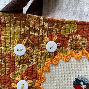 Tote bag met borduurwerk met puttertjes