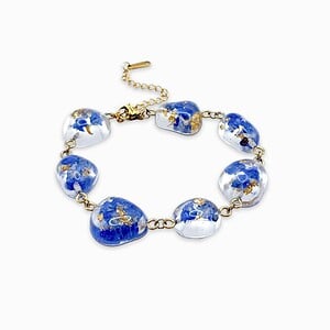 Armband met Steenvormige Hangers Gevuld met Echte Bloemen uit Den Haag (The Tide)