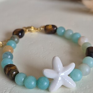 Zomerse zeester armband goud