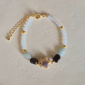 Gouden armband keramieken zeester