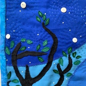 Patchwork wandkleed met de maan en uiltje