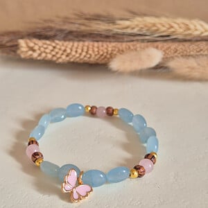 Vrolijke roze/gouden vlinder armband