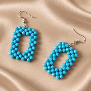 Turquoise Kralen Oorbellen | Blauwe Statement Hangoorbellen met Facetkralen Productomschrijving voor Swan Market