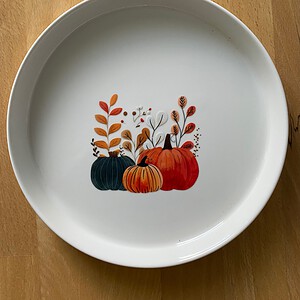 Rond bordje met pompoenen
