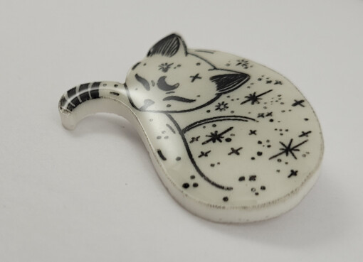 Slapende kosmische glow in the dark kitten magneet