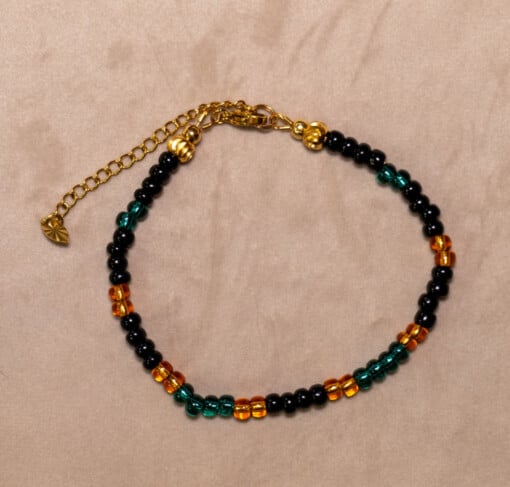 Armband van rocailles in oranje, zwart en donkergroen