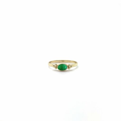 Tiny Facet Emerald Oval Triquetra Gold