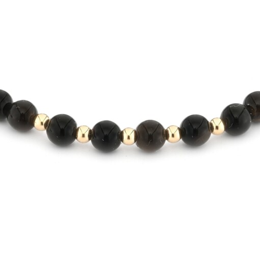 Elegante zwart onyx armband met 14 karaat geelgouden kralen 2,5 mm