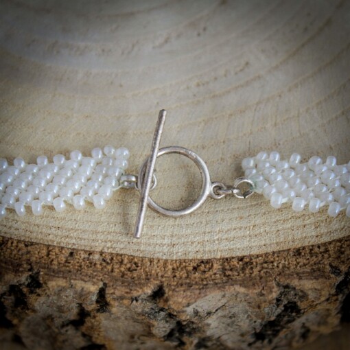 Asymmetrische boho ketting met schelp en parel – bruids- of strandaccessoire