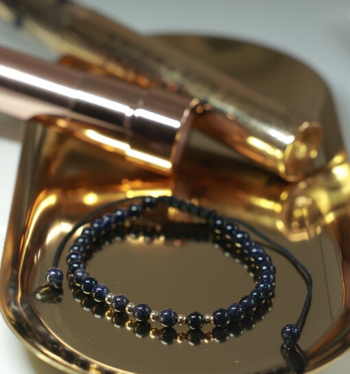 Blauwe goudsteen armband met 14 karaat geelgouden kralen
