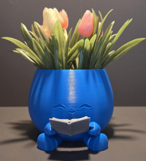 lachende bloempot met boek