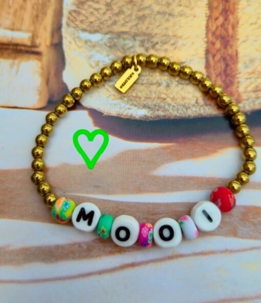 Armbanden van hematie goud kralen +woordjes