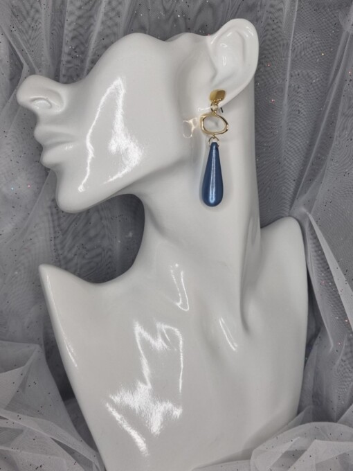 Vergulde statement oorbellen met polaris - blauw